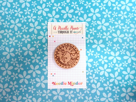 Cat round needle minder