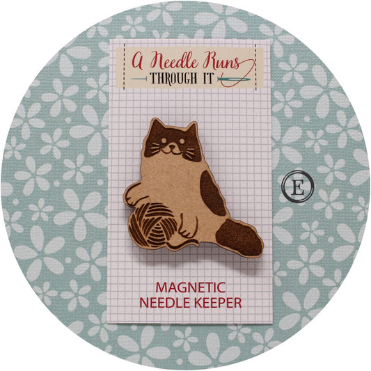 Cat with yarn needle minder